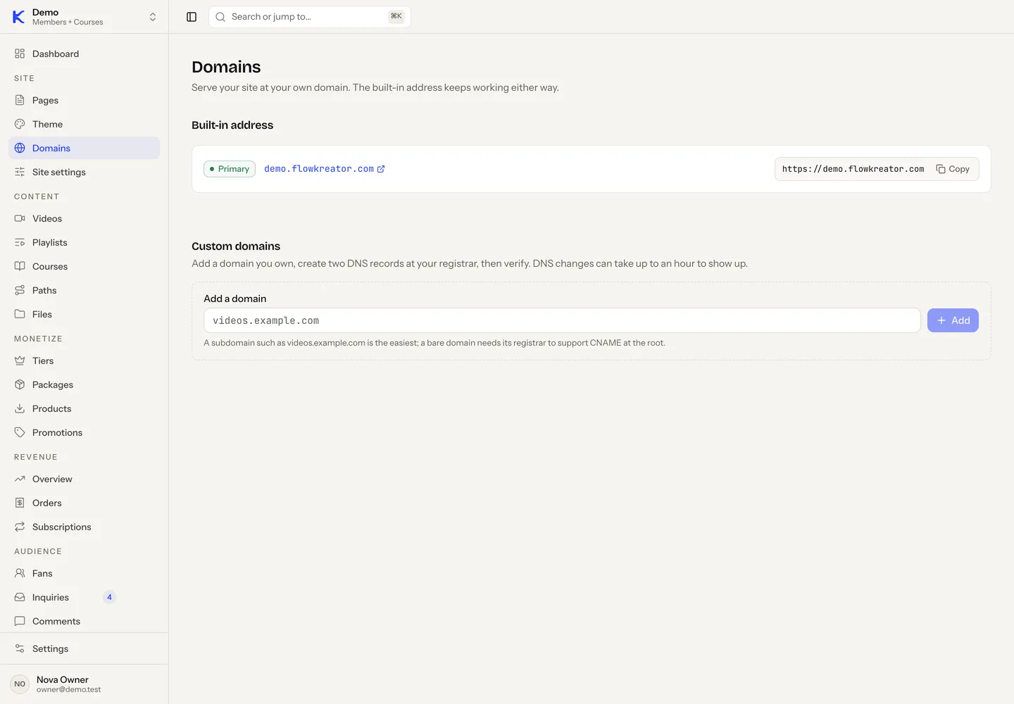 The Domains screen in the dashboard showing the built-in flowkreator.com address and a field to add a custom domain.